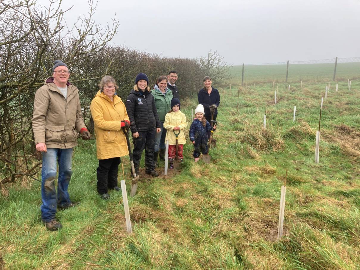 Members of Nolton and Roch Community standing by their planted trees