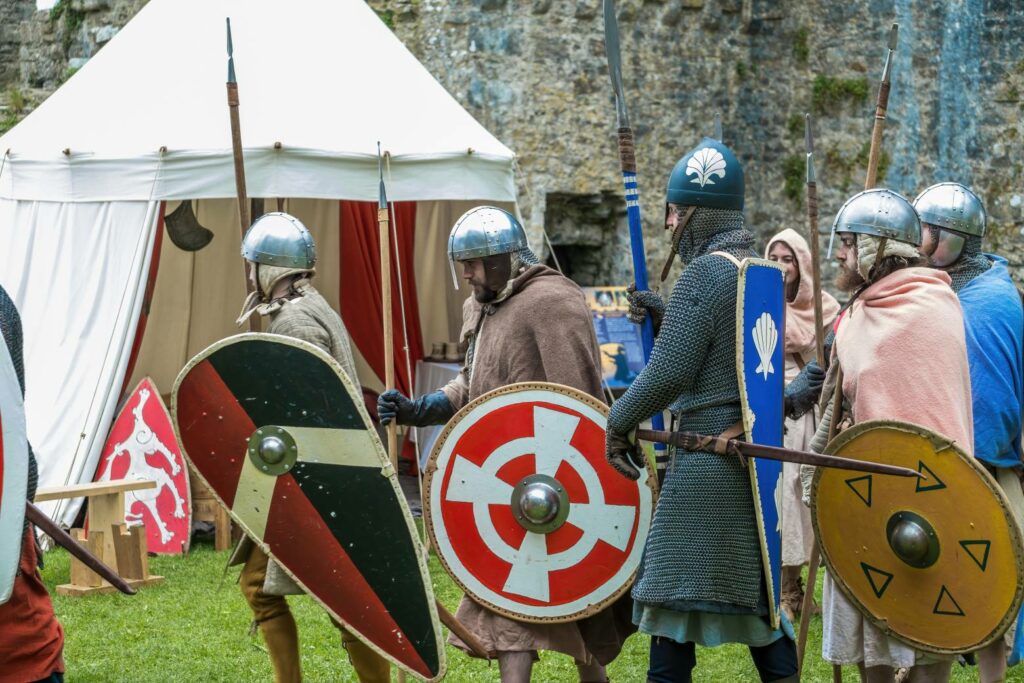 A group of medieval soldiers with shields and swords.